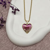Collana cuore rosa con micio dorato